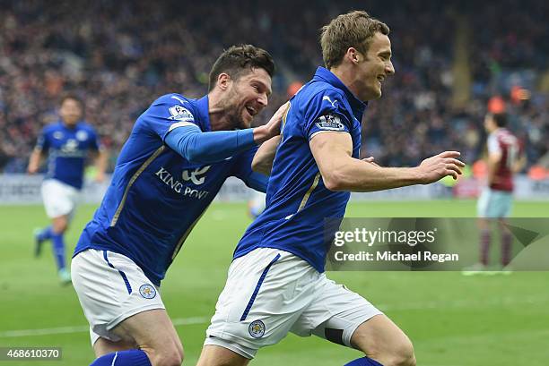 Andy King of Leicester City celebrates scoring their second goal with David Nugent during the Barclays Premier league match Leicester City and West...