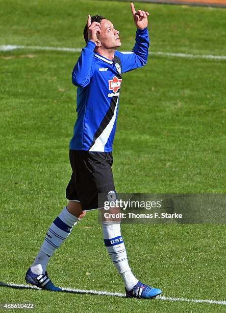 Christian Mueller of Bielefeld celebrates scoring his teams third goal during the Third League match between Arminia Bielefeld and Energie Cottbus at...