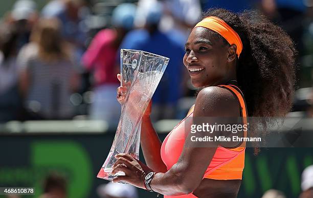 Serena Williams poses with the trophy after winning the Women's Final of the Miami Open presented by Itau against Carla Suarez Navarro of Spain...
