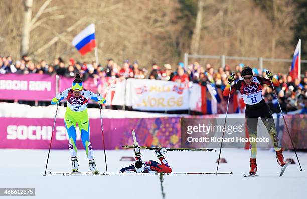 Katja Visnar of Slovenia and Denise Herrmann of Germany cross the finish line in the Finals of the Ladies' Sprint Free during day four of the Sochi...