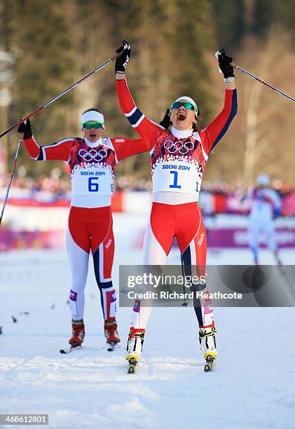 Maiken Caspersen Falla of Norway and Ingvild Flugstad Oestberg of Norway celebrate winning first and second place in the Finals of the Ladies' Sprint...