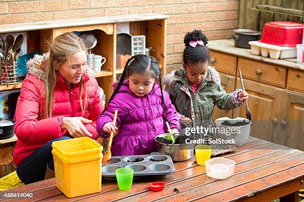 messy mud pies - preschool student stock pictures, royalty-free photos & images