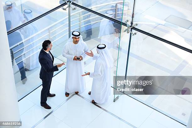 three arab business men meeting - middle eastern people stock pictures, royalty-free photos & images