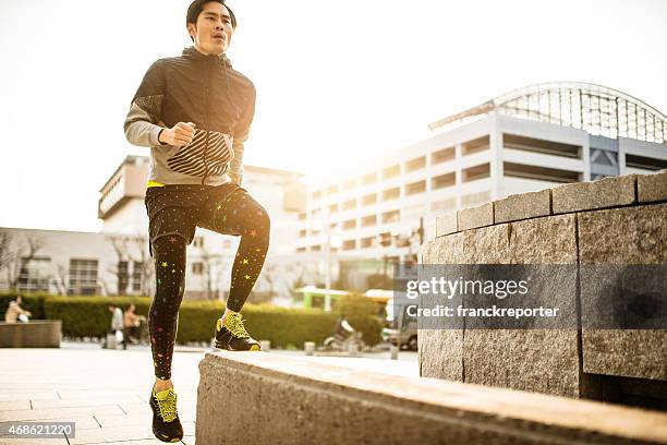 japanese man doing step up on the city - japan training session stock pictures, royalty-free photos & images