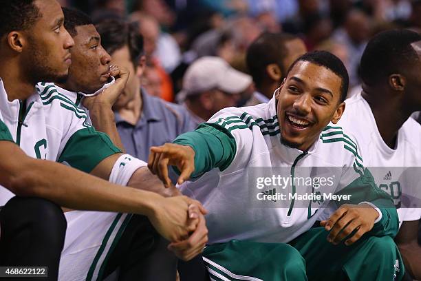 Phil Pressey of the Boston Celtics laughs on the bench during the fourth quarter against the Milwaukee Bucks at TD Garden on April 3, 2015 in Boston,...