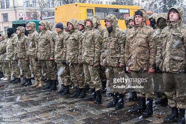 Ukrainians gather at a square to see off Ukrainian army's 92nd Brigade's soldiers, who will be clash with pro-Russian separatists in the eastern of...