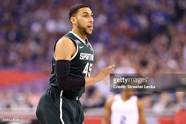 Denzel Valentine of the Michigan State Spartans reacts after making a three-pointer in the first half against the Duke Blue Devils during the NCAA...