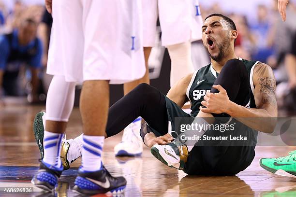 Denzel Valentine of the Michigan State Spartans reacts on the court after a play in the first half against the Duke Blue Devils during the NCAA Men's...