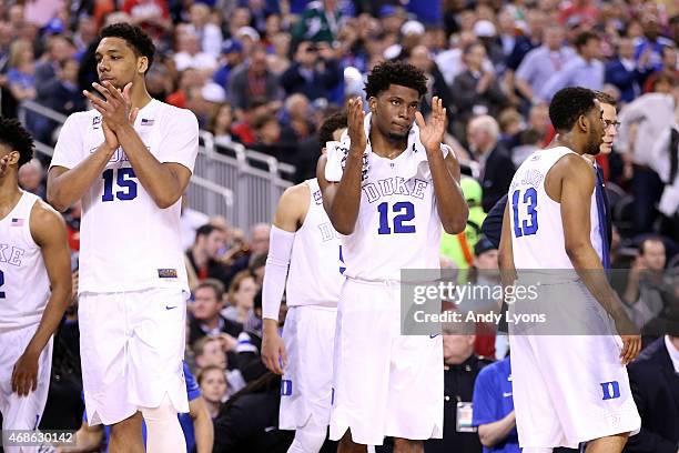 Jahlil Okafor and Justise Winslow of the Duke Blue Devils celebrate after defeating the Michigan State Spartans during the NCAA Men's Final Four...