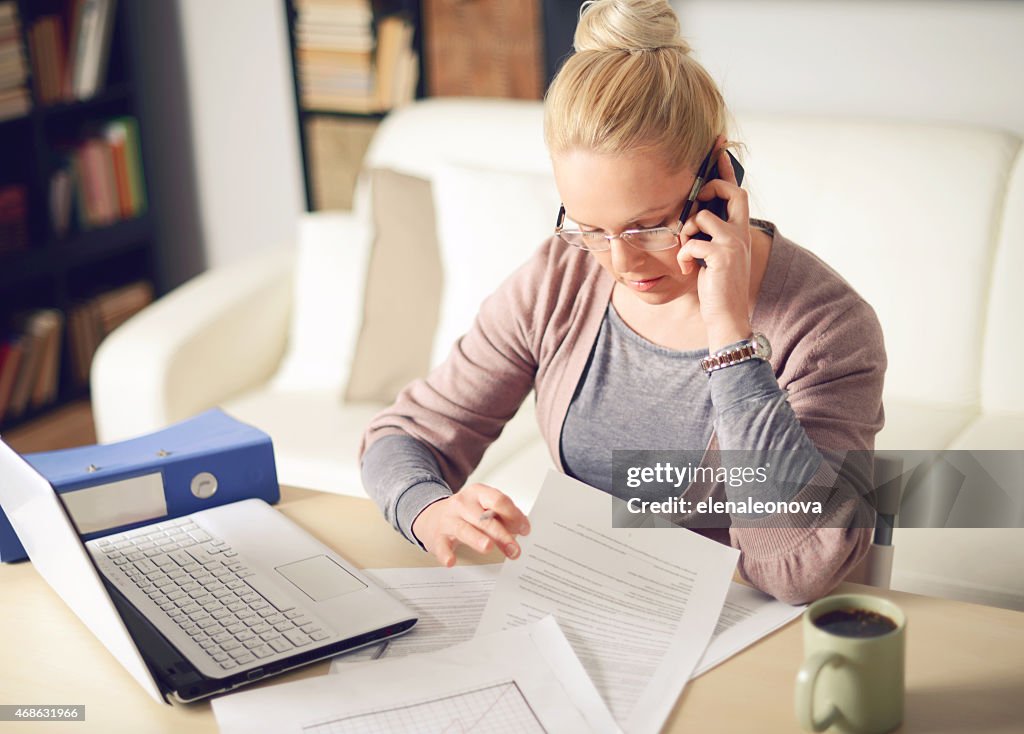 Blonde woman working at home