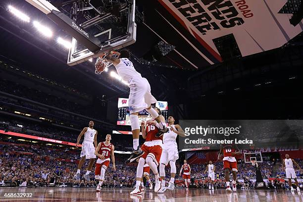 Willie Cauley-Stein of the Kentucky Wildcats goes up for a dunk against Sam Dekker of the Wisconsin Badgers in the first half during the NCAA Men's...