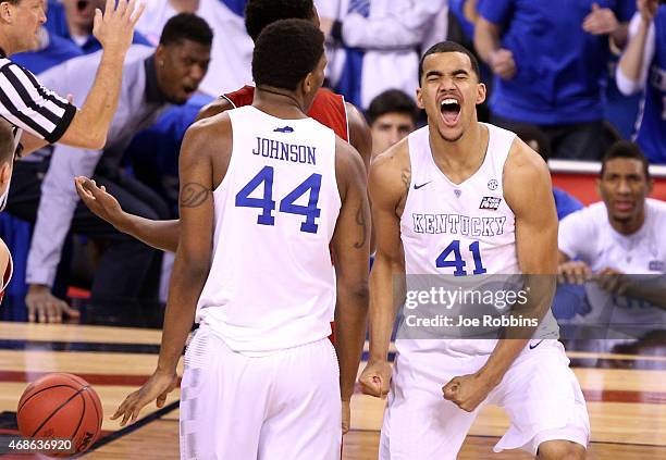 Dakari Johnson and Trey Lyles of the Kentucky Wildcats react after a play in the second half against the Wisconsin Badgers during the NCAA Men's...