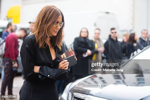 Christine Centera of Vogue Australia enters Ferragamo on Day 5 of Milan Fashion Week FW15 on March 1, 2015 in Milan, Italy.