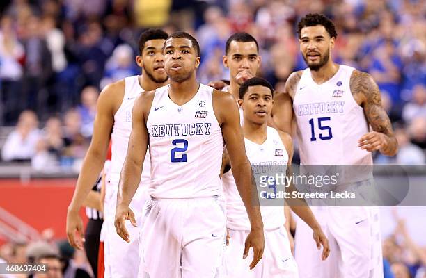 Aaron Harrison of the Kentucky Wildcats reacts late in the game with teammates Karl-Anthony Towns, Tyler Ulis, Trey Lyles and Willie Cauley-Stein...