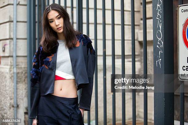 Model Dylan Xue exits the Roberto Cavalli show in a 3.1 Phillip Lim outfit and Adidas sneakers on Day 4 of Milan Fashion Week FW15 on February 28,...