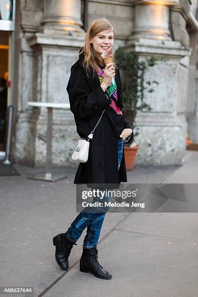 Model Alexandra Elizabeth Ljadov exits the Jil Sander show in a Versace shirt and Coach bag on Day 4 of Milan Fashion Week FW15 on February 28, 2015...