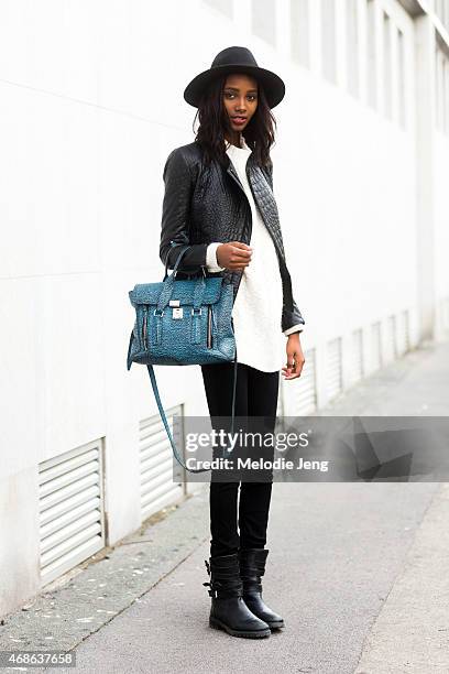 Model Tami Williams exits the Bottega Veneta show with a 3.1 Phillip Lim bag on Day 4 of Milan Fashion Week FW15 on February 28, 2015 in Milan, Italy.