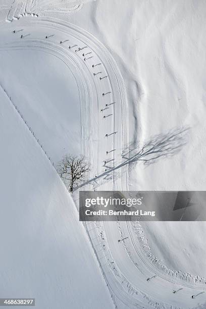 aerial view of cross country skiers on track - ski race stock-fotos und bilder