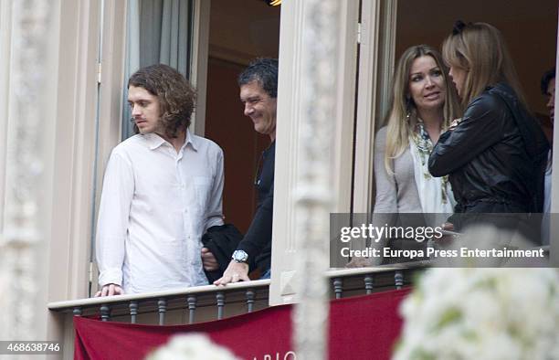 Alexander Bauer, Antonio Banderas and Nicole Kimpel attend Holy procession during Holy Week celebration on March 31, 2015 in Malaga, Spain.