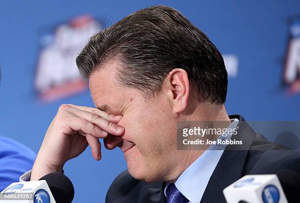 Head coach John Calipari of the Kentucky Wildcats reacts in the post game press conference after being defeated by the Wisconsin Badgers during the...