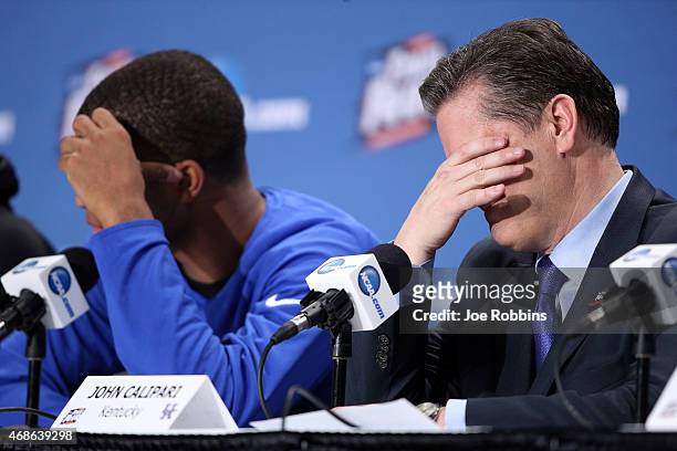 Head coach John Calipari of the Kentucky Wildcats reacts in the post game press conference after being defeated by the Wisconsin Badgers during the...