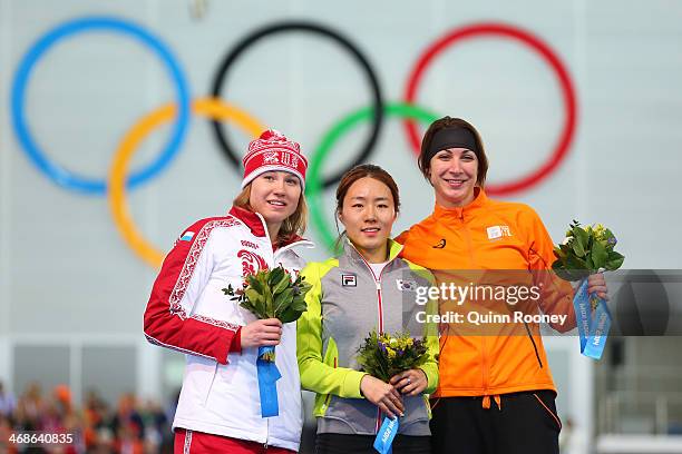 Silver medalist Olga Fatkulina of Russia, gold medalist Sang Hwa Lee of South Korea and bronze medalist Margot Boer of the Netherlands on the podium...