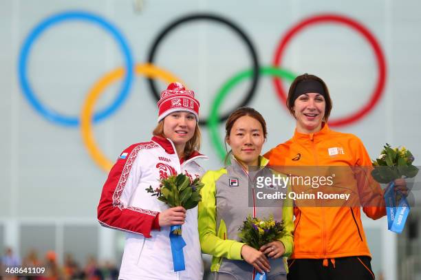 Silver medalist Olga Fatkulina of Russia, gold medalist Sang Hwa Lee of South Korea and bronze medalist Margot Boer of the Netherlands on the podium...