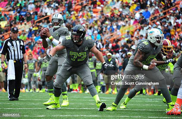 Marshal Yanda of the Baltimore Ravens and Mike Pouncey of the Miami Dolphins and Team Sanders block against Team Rice during the 2014 Pro Bowl at...