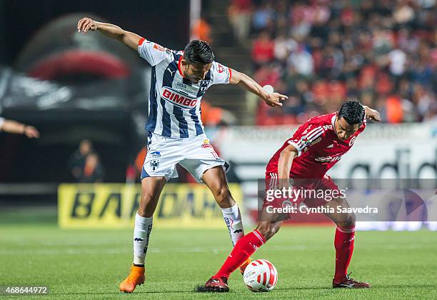 Jesus Zavala of Monterrey and Alfredo Moreno of Xolos fight for the ball during a match between Tijuana and Monterrey as part of 12th round Clausura...