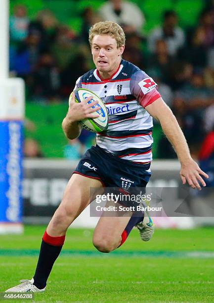 Bryce Hegarty of the Rebels runs with the ball during the round eight Super Rugby match between the Rebels and the Reds at AAMI Park on April 3, 2015...