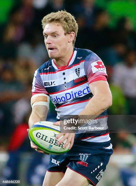 Bryce Hegarty of the Rebels runs with the ball during the round eight Super Rugby match between the Rebels and the Reds at AAMI Park on April 3, 2015...