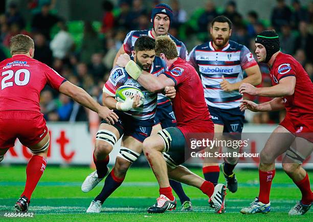 Colby Faingaa of the Rebels runs with the ball during the round eight Super Rugby match between the Rebels and the Reds at AAMI Park on April 3, 2015...