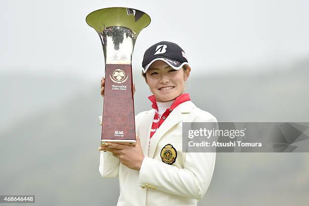 Ayaka Watanabe of Japan poses with the trophy after winning the YAMAHA Ladies Open Katsuragi at the Katsuragi Golf Club Yamana Course on April 5,...