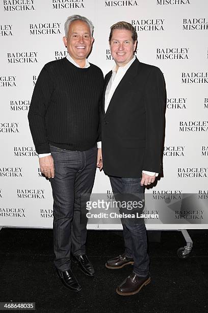 Designers Mark Badgley and James Mischka pose backstage at the Badgley Mischka fashion show during Mercedes-Benz Fashion Week Fall 2014 at The...