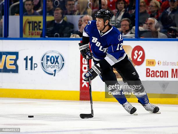 Ryan Malone of the Tampa Bay Lightning looks to pass against the Detroit Red Wings at the Tampa Bay Times Forum on February 8, 2014 in Tampa, Florida.