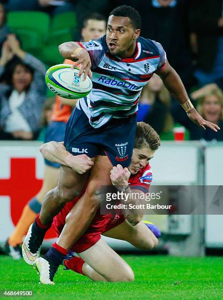 Sefanaia Naivalu of the Rebels runs with the ball during the round eight Super Rugby match between the Rebels and the Reds at AAMI Park on April 3,...
