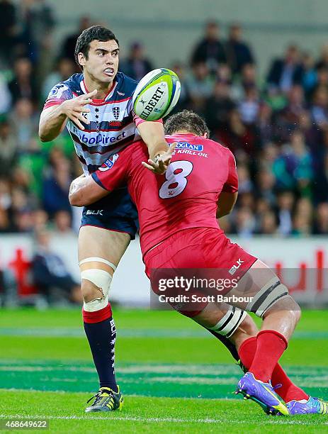 Jack Debreczeni of the Rebels runs with the ball during the round eight Super Rugby match between the Rebels and the Reds at AAMI Park on April 3,...