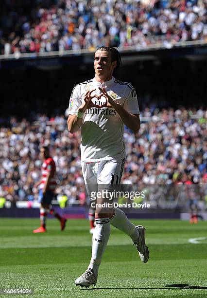 Gareth Bale of Real Madrid CF celebrates after scoring his team's opening goal during the La Liga match between Real Madrid CF and Granada CF at...