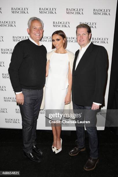 Designer Mark Badgley, Giuliana Rancic and designer James Mischka pose backstage at the Badgley Mischka fashion show during Mercedes-Benz Fashion...