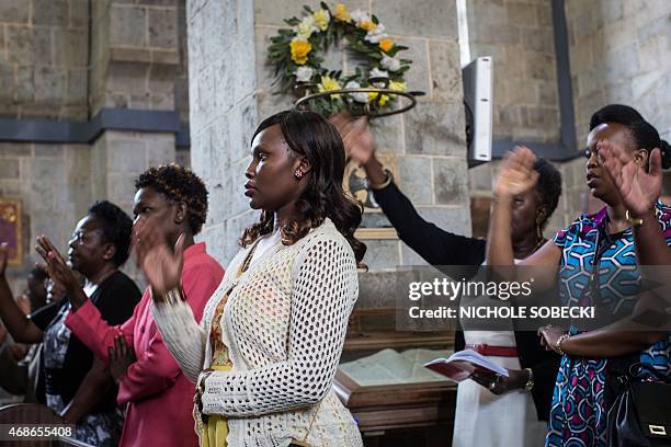 Worshippers gather for an Easter service at the All Saints' Cathedral in Nairobi on April 5 mourning the country's worst ever massacres, the killing...