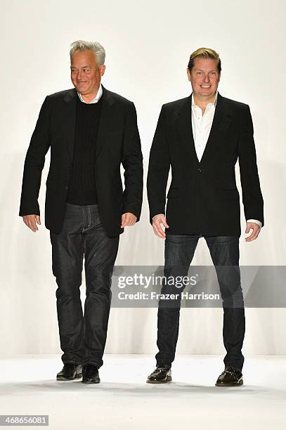 Designers Mark Badgley and James Mischka walk the runway at the Badgley Mischka fashion show during Mercedes-Benz Fashion Week Fall 2014 at The...