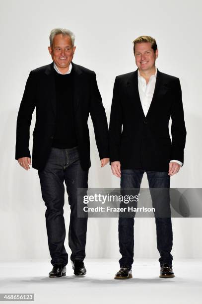 Designers Mark Badgley and James Mischka walk the runway at the Badgley Mischka fashion show during Mercedes-Benz Fashion Week Fall 2014 at The...