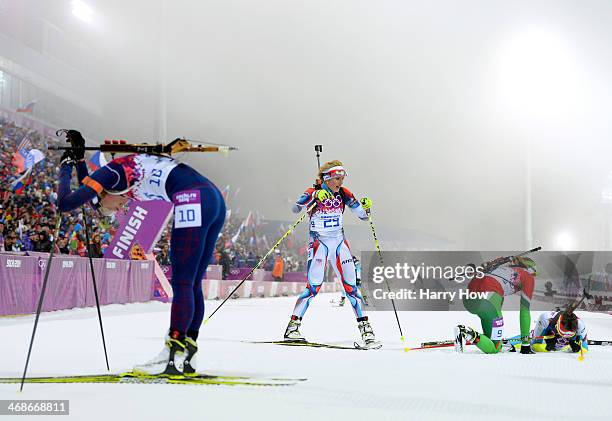 Tora Berger of Norway and Gabriela Soukalova of the Czech Republic react after the Women's 10 km Pursuit during day four of the Sochi 2014 Winter...