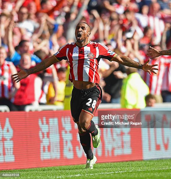 Jermain Defoe of Sunderland celebrates scoring the opening goal during the Barclays Premier League match between Sunderland and Newcastle United at...
