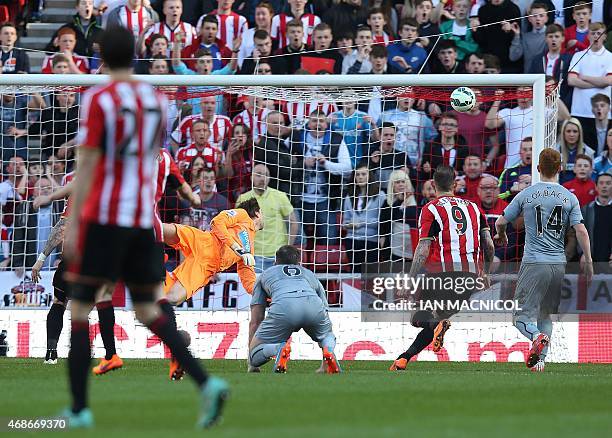 Newcastle United's Dutch goalkeeper Tim Krul watches as Sunderland's English striker Jermain Defoe's shot goes into the top corner of his net for...