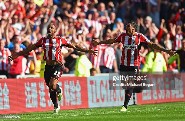 Jermain Defoe of Sunderland celebrates scoring the opening goal with Patrick van Aanholt of Sunderland during the Barclays Premier League match...