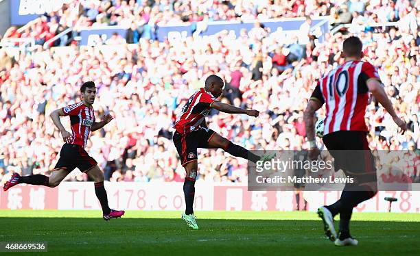 Jermain Defoe of Sunderland scores the opening goal during the Barclays Premier League match between Sunderland and Newcastle United at Stadium of...