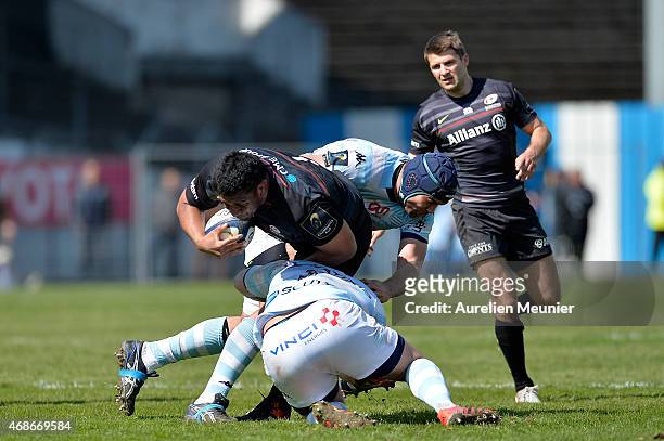 Mako Vunipola of Saracens is tackled by Francois Van Der Merwe of Racing Metro 92 during the European Rugby Champions Cup quarter final match between...