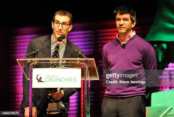 Jordan Novet of VentureBeat and Travis Kalanick of Uber present the award for Best Design at the 7th Annual Crunchies Awards at Davies Symphony Hall...