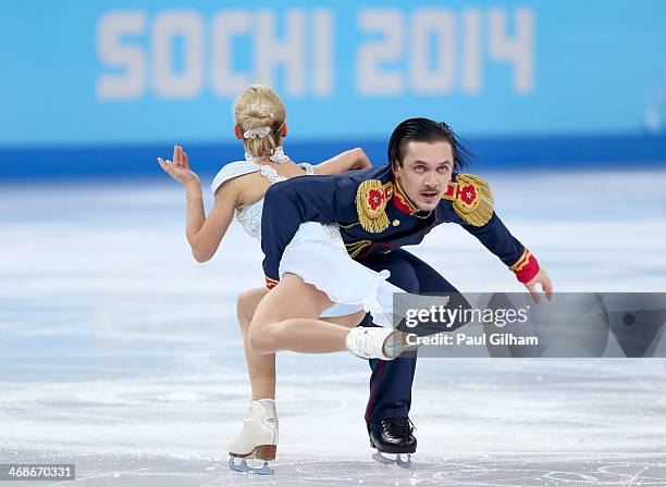 Tatiana Volosozhar and Maxim Trankov of Russia compete during the Figure Skating Pairs Short Program on day four of the Sochi 2014 Winter Olympics at...